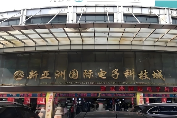 Stall in Guangzhou electronics market with phone cases and cables