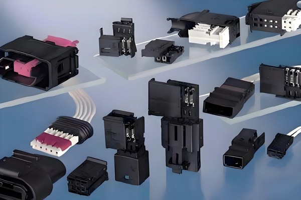 An array of different types of electronic connectors and colorful cable assemblies